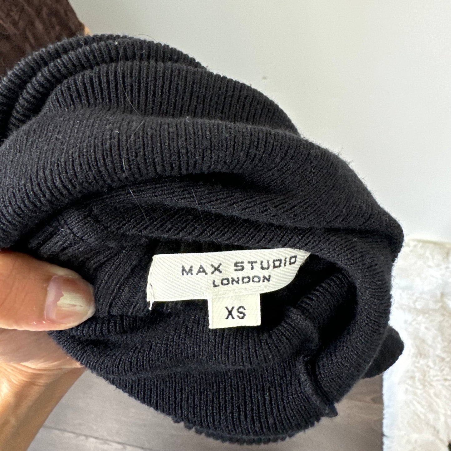 Black Sleeveless Turtleneck Knit Top